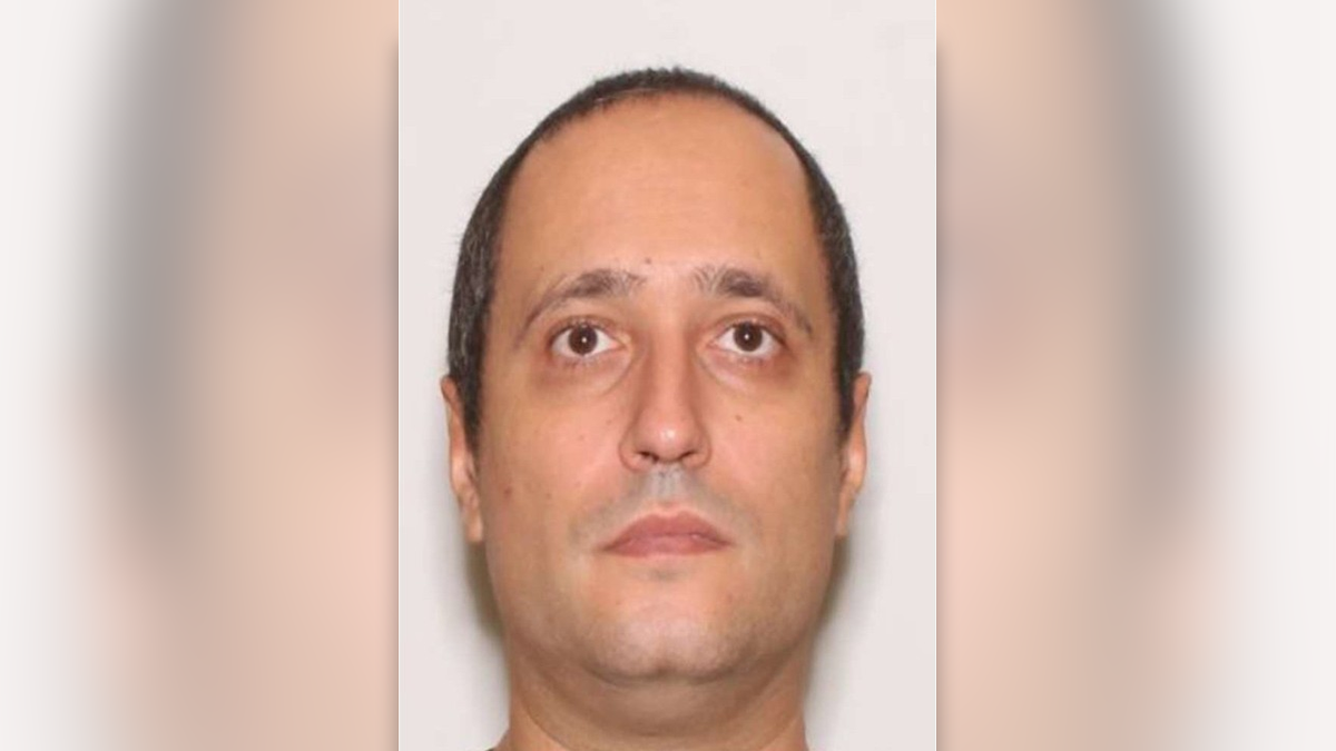 A photo of Claudio Neves-Valente from the neck up, showing him with a receding hairline, brown eyes and a cleft chin