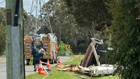 A man was trapped inside a crane after it crashed into a power pole on Hemmant Tingalpa Road near Youngs Road at Hemmant.