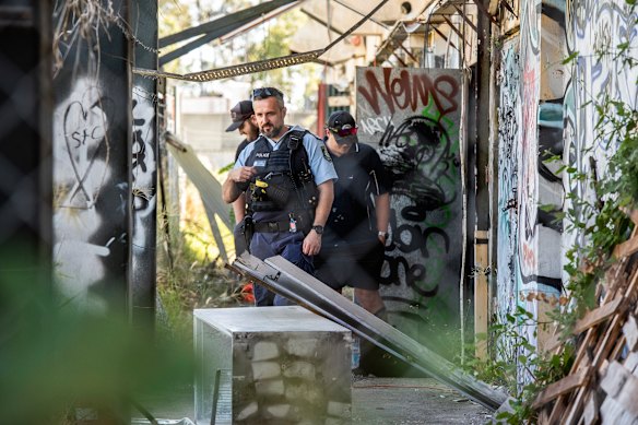 Police at the scene after a fire at the Homebush Theatre.