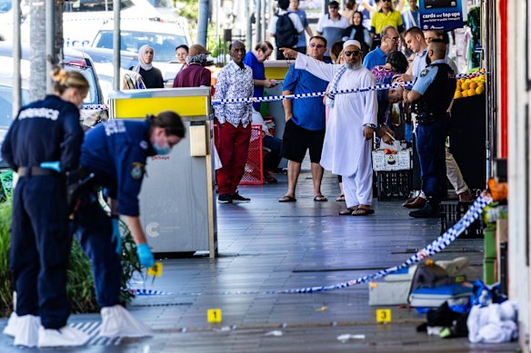 Emergency services at Merrylands, where one person was killed and two injured in a stabbing attack.