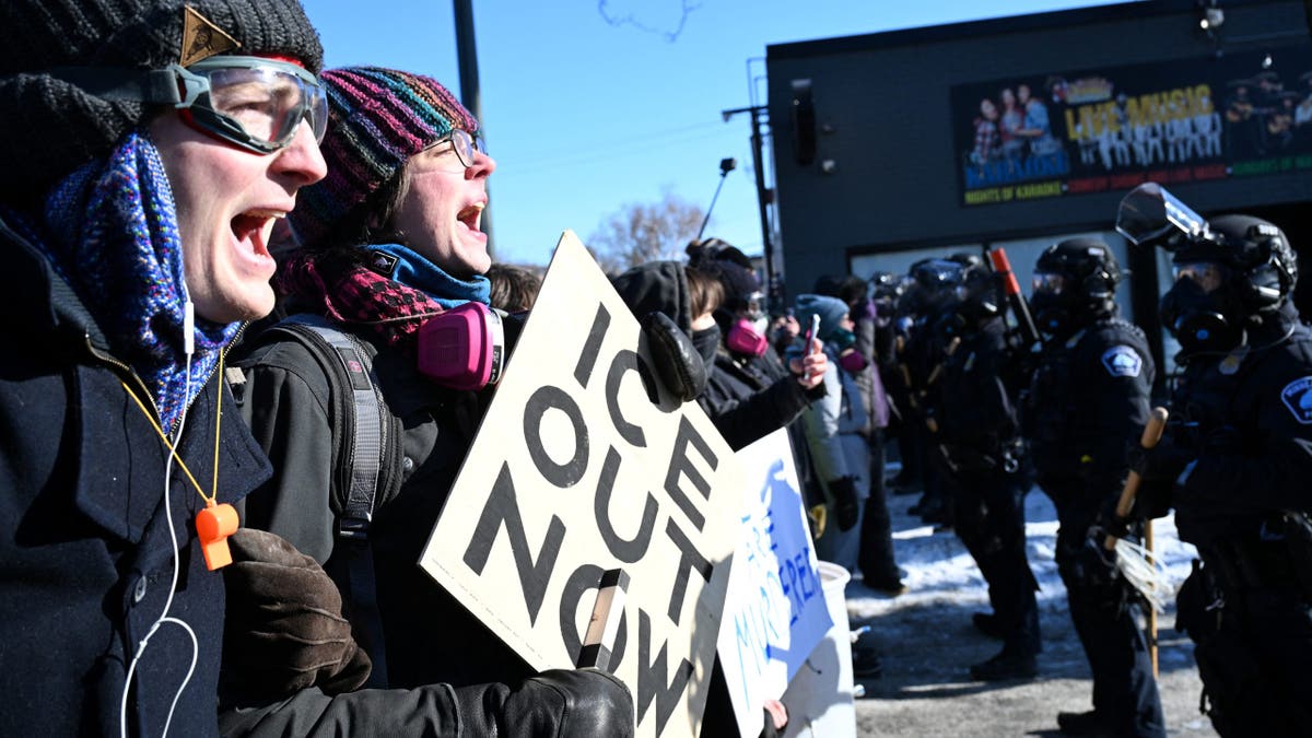 Protesters face off with Minneapolis police officers in Minneapolis, Minn.