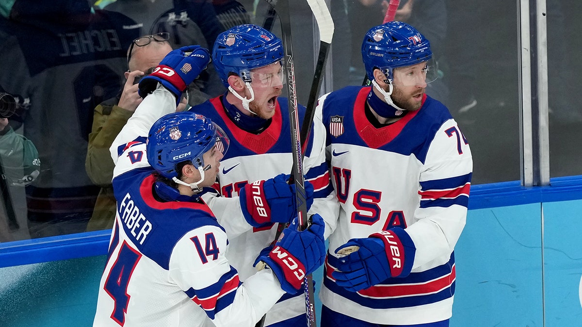 Jack Eichel celebrates with Brock Faber
