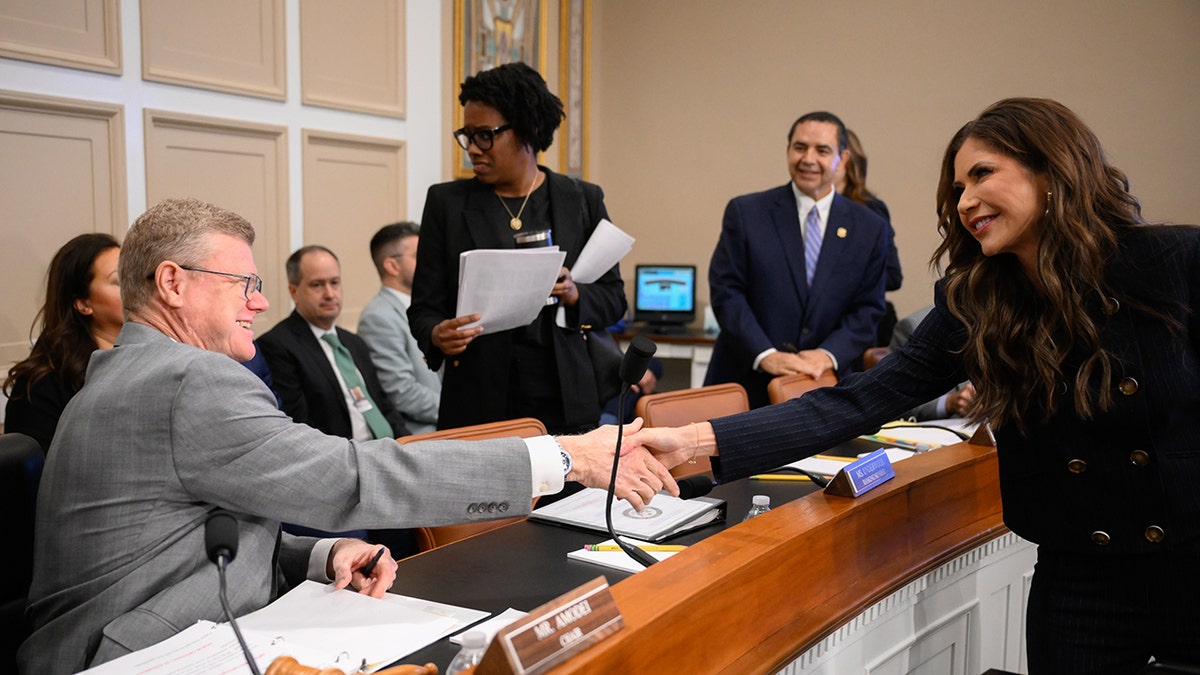 Amodei shakes Noem's hand in hearing