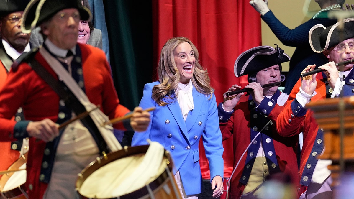 New Jersey Gov. Mikie Sherrill walks onto stage during her inauguration ceremony in Newark.