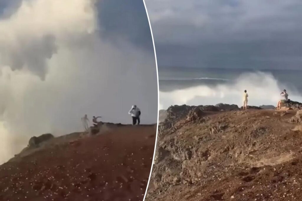 Watch heart-stopping footage of death-defying beachgoers getting smashed by a massive wave while snapping cliffside selfies