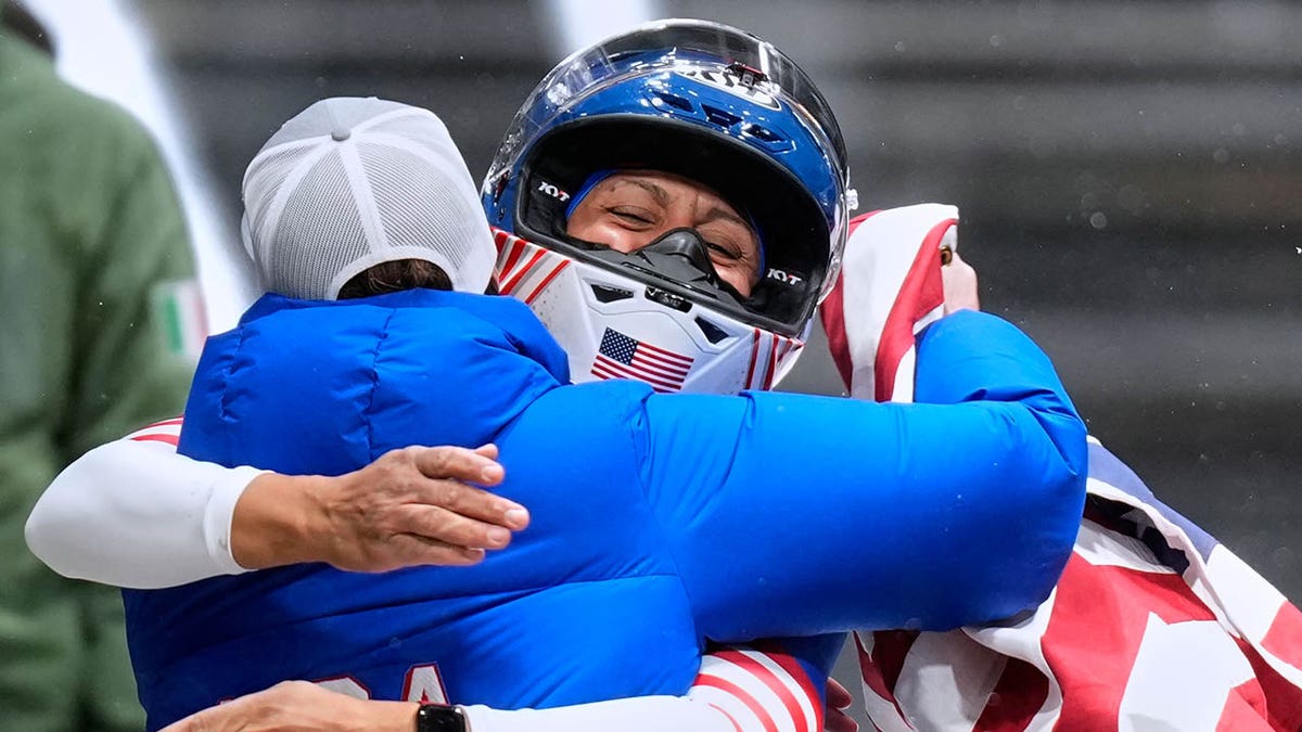 Elana Meyers Taylor celebrates with her coaches