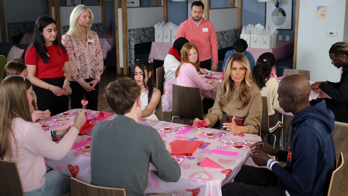melania trump sitting with children at NIH for valentines day craft