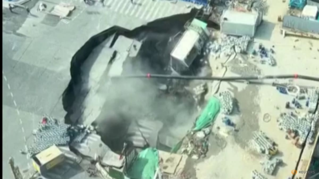 Massive sinkhole swallows road, part of construction site near downtown Shanghai