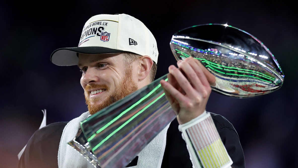 Sam Darnold holds the Vince Lombardi Trophy