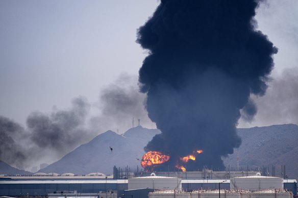 Smoke rises after debris from an intercepted Iranian drone struck an oil facility in Fujairah, United Arab Emirates.