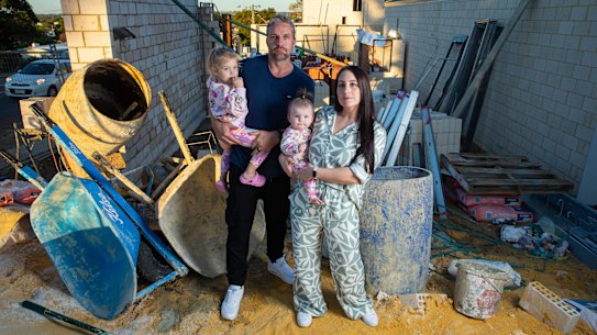Cara and Jason Godwin with their two children Sage (2) and Summer (8 months) on their family home building site in Doubleview,