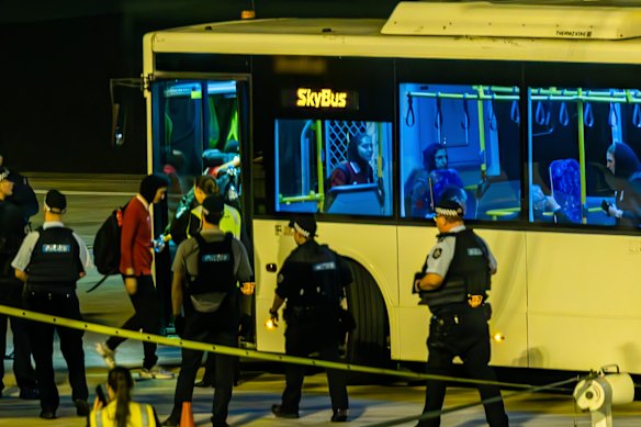 The team board a bus at Sydney Airport.