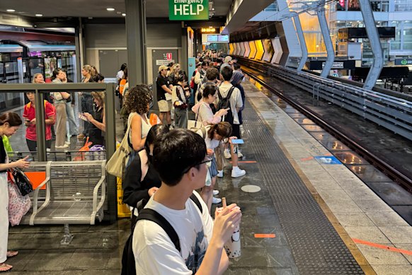 Commuters waiting at Chatswood station during the storm.