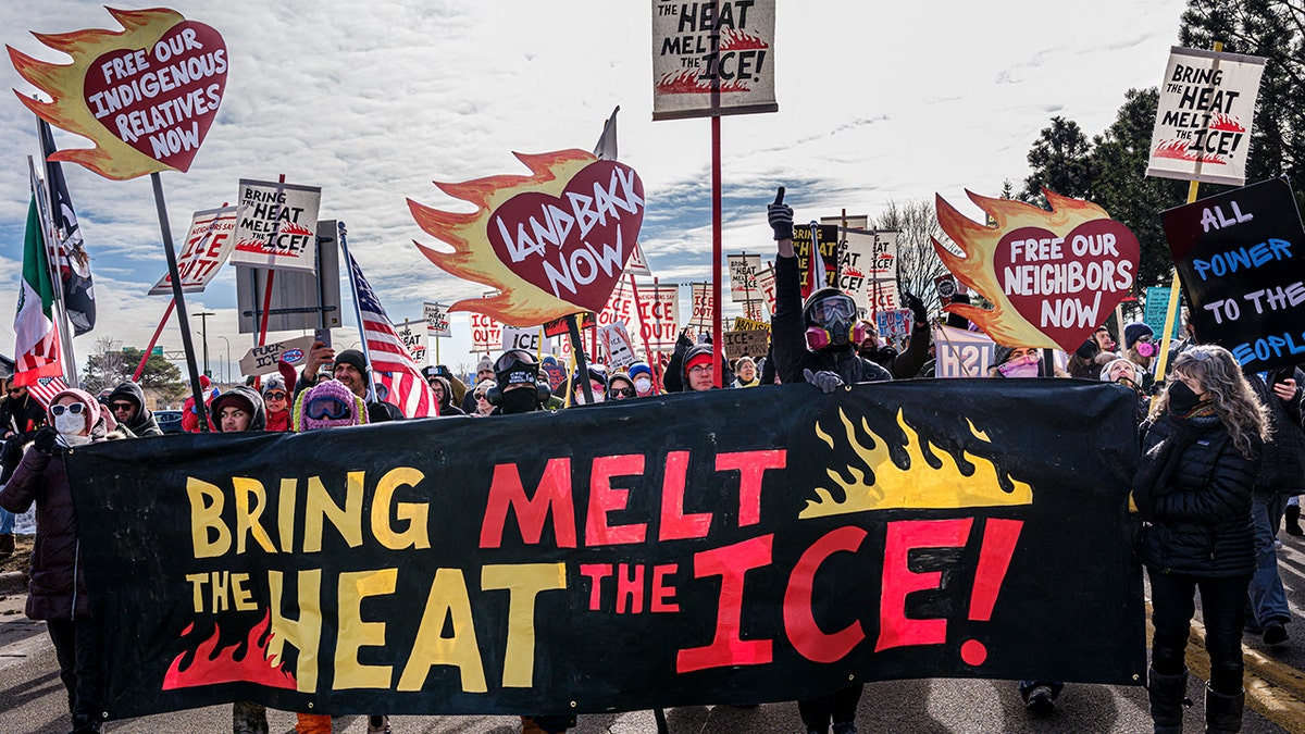 Indigenous and local activists march outside the Bishop Henry Whipple Federal Building in Minneapolis