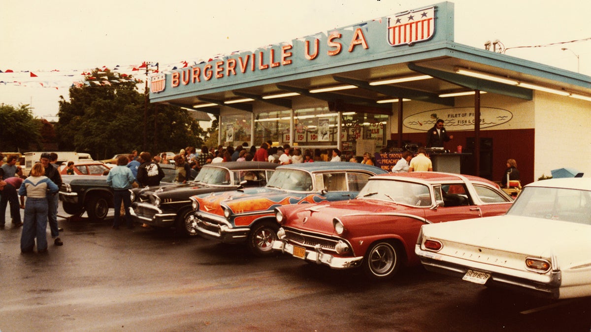 Car show outside Burgerville USA in the 60s.