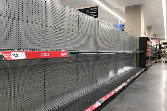 Empty shelves in the toilet paper aisle at Woolworths in Bondi Junction, NSW, in March 2020.
 