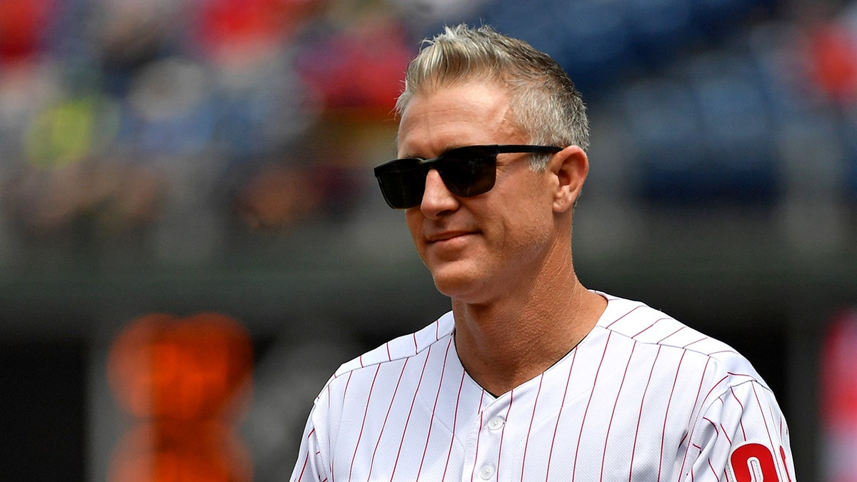 Chase Utley looks on