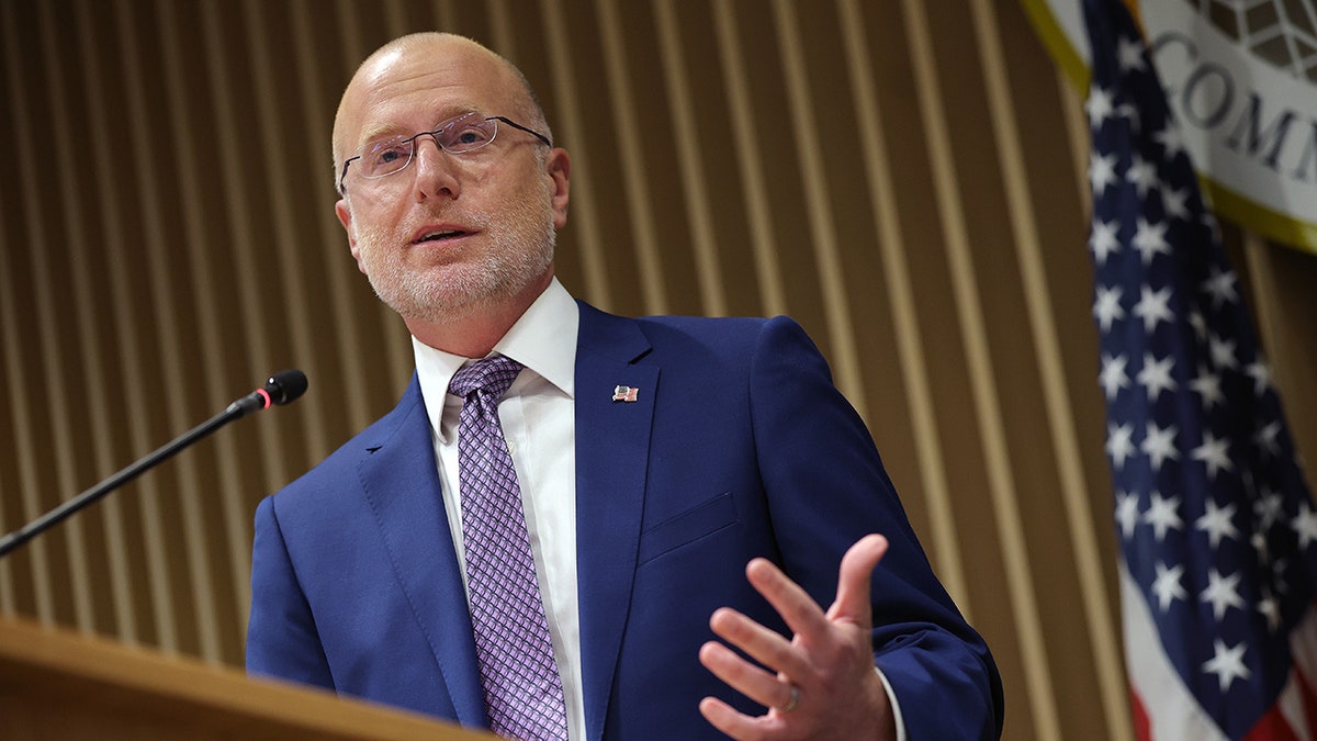 Federal Communications Commission official speaks at a press conference 