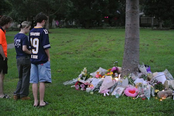 Several hundred people gathered from 5.30pm on Friday to light candles for Paterson and her daughter, April.