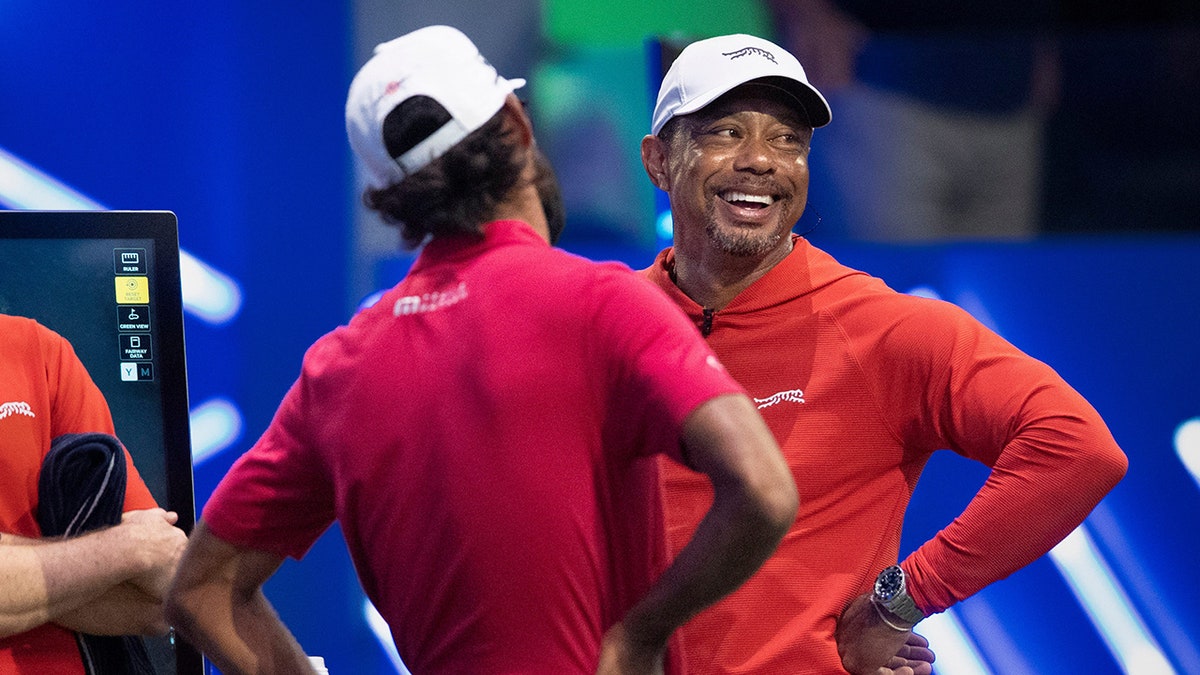 Tiger Woods jokes with Akshay Bhatia