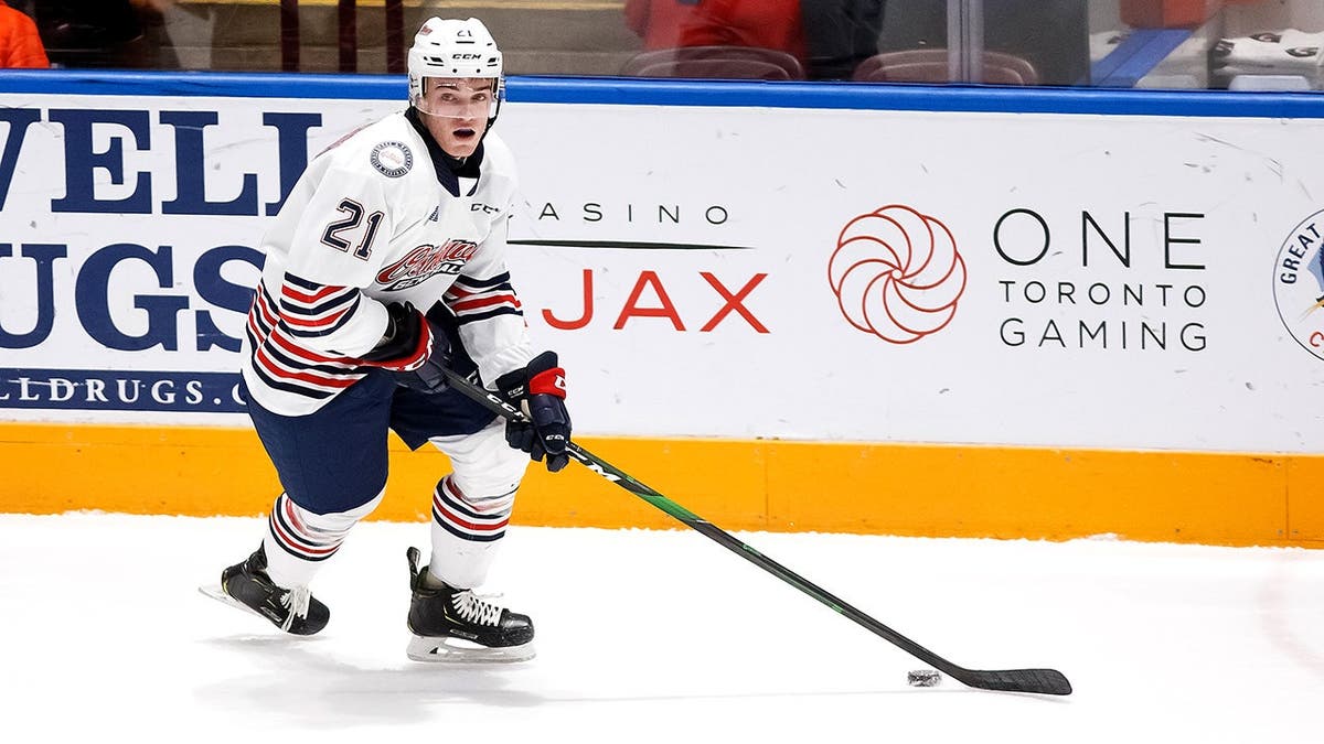Jacob Winterton skating with the puck during an OHL game