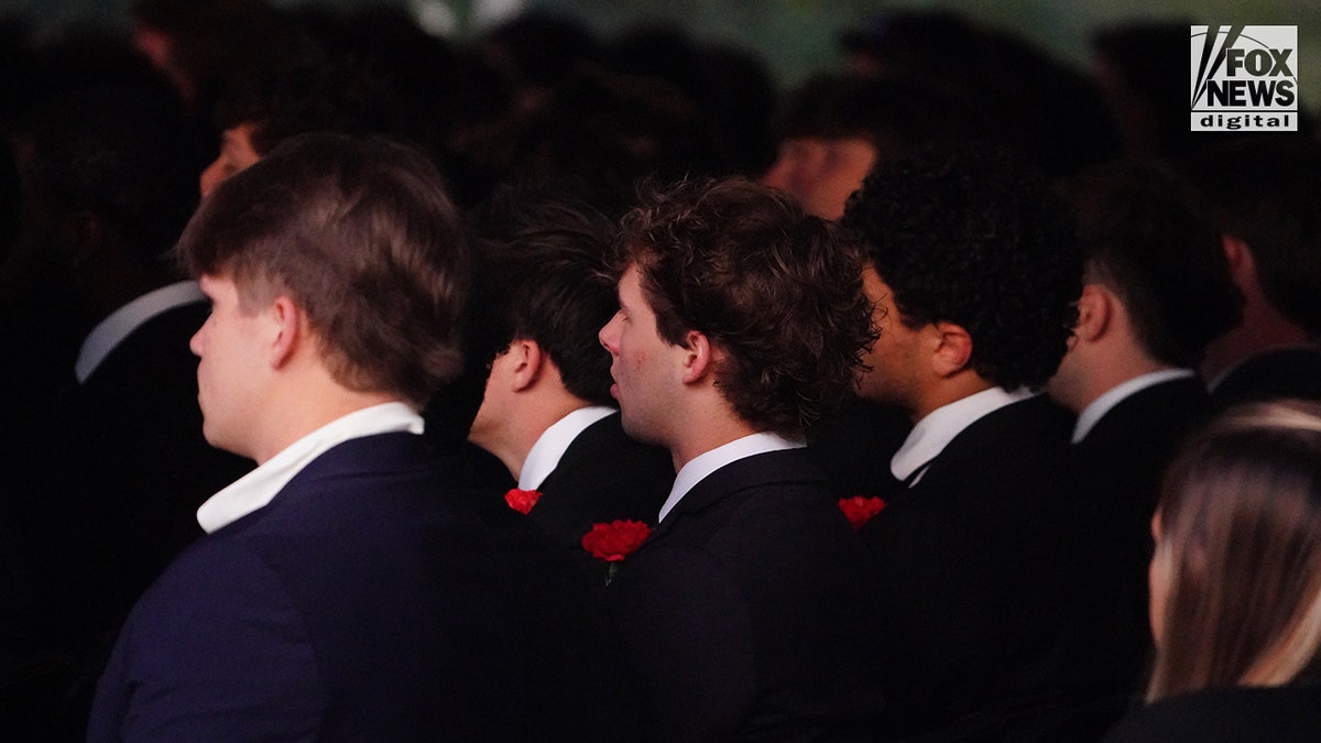 Mourners at a memorial vigil for Jimmy Gracey standing together