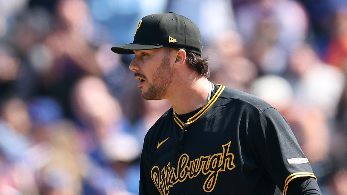 Paul Skenes looks on field