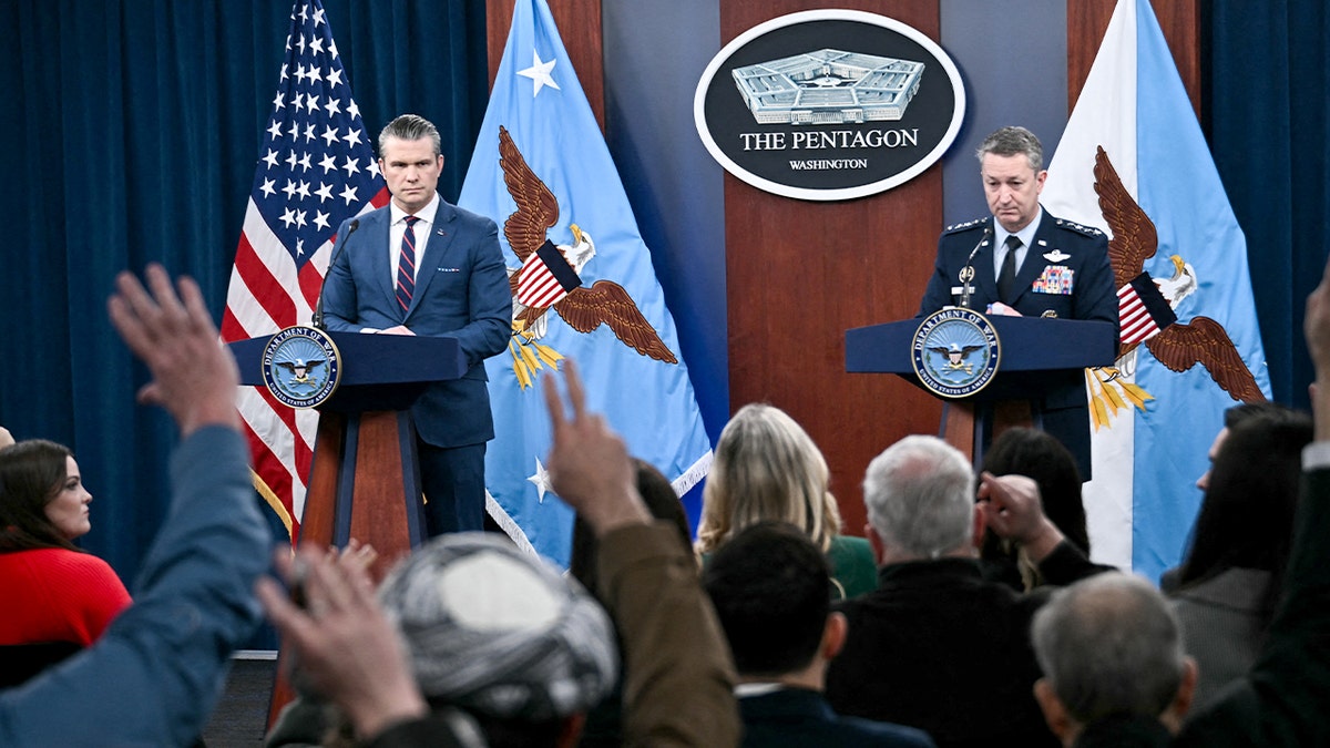 War Secretary Pete Hegseth and Gen. Dan Caine respond to reporters during a Pentagon briefing.