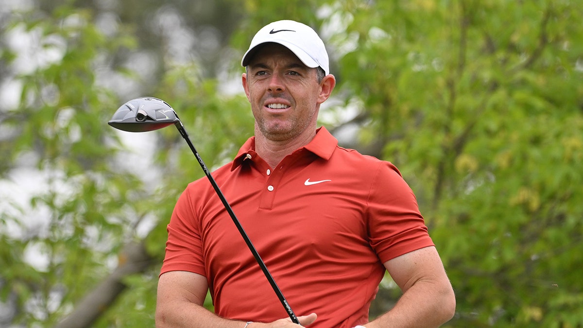 Rory McIlroy reacts to golf shot