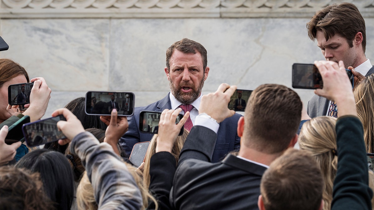 Sen. Markwayne Mullin speaking to reporters at the Capitol.