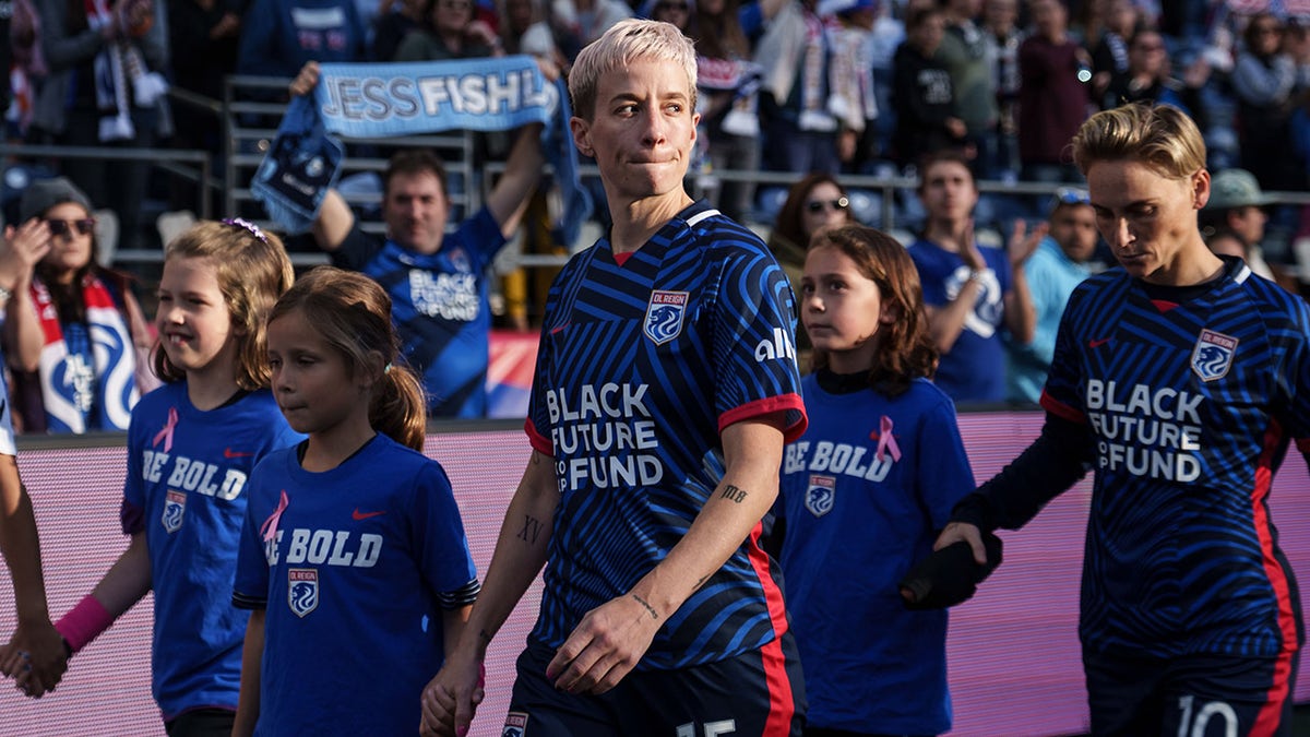 Megan Rapinoe walks onto the field