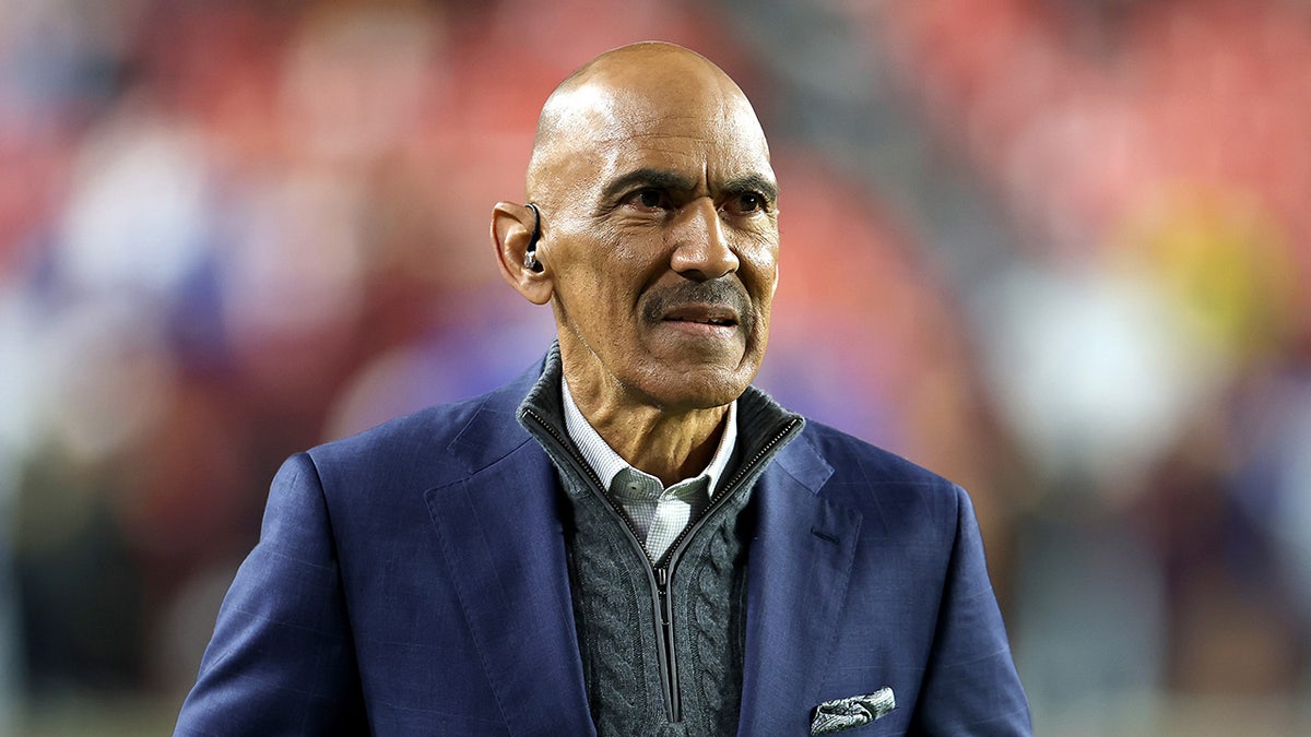 Tony Dungy looks on