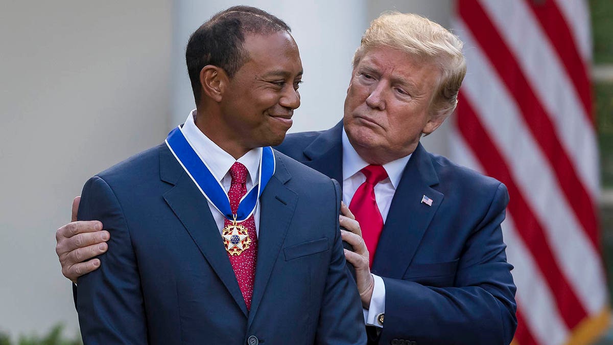 President Donald Trump presenting the Presidential Medal of Freedom to Tiger Woods in the White House Rose Garden