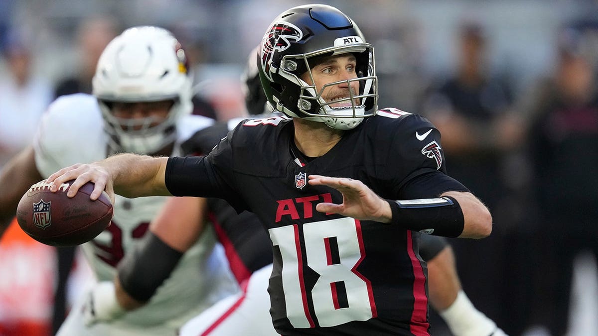 Atlanta Falcons quarterback Kirk Cousins throwing a football during a game against the Arizona Cardinals