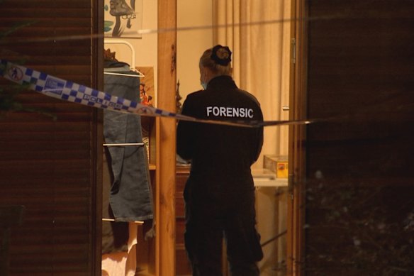 A police forensic officer at the house after the shooting.