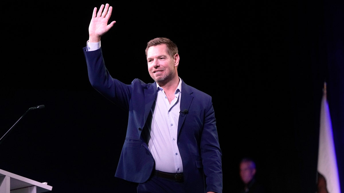 Eric Swalwell waving before speaking at California Democratic Party State Convention