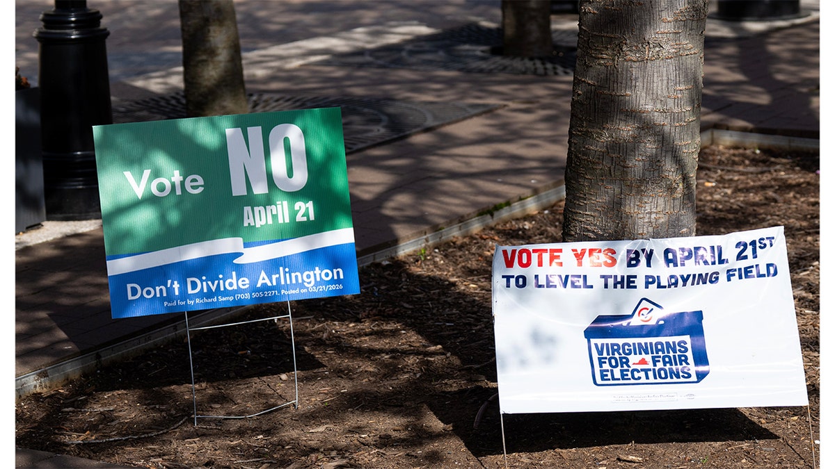 Signs urging early voters to vote yes or no on Virginia redistricting referendum at government center