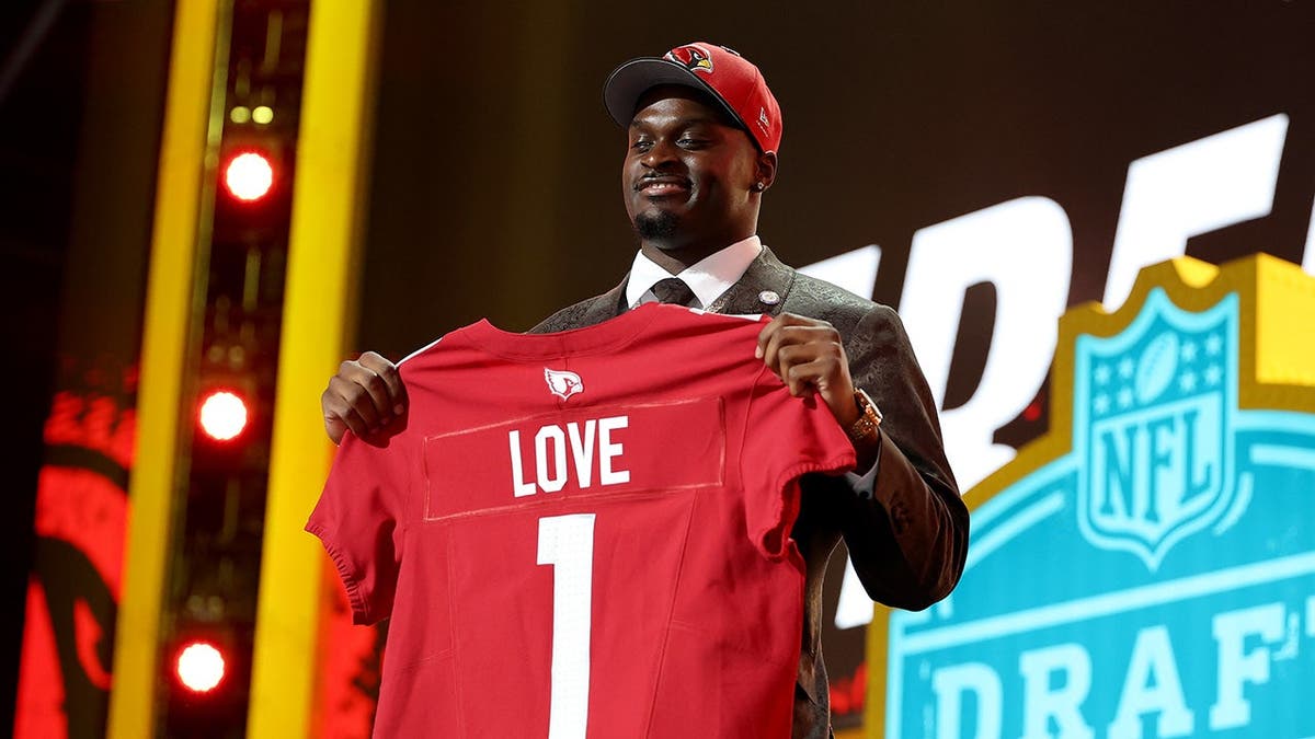 Jeremiyah Love celebrating after being selected by the Arizona Cardinals at the NFL Draft.