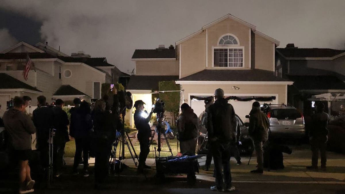 Media and onlookers gathered in front of a house connected to Cole Tomas Allen in Torrance, California