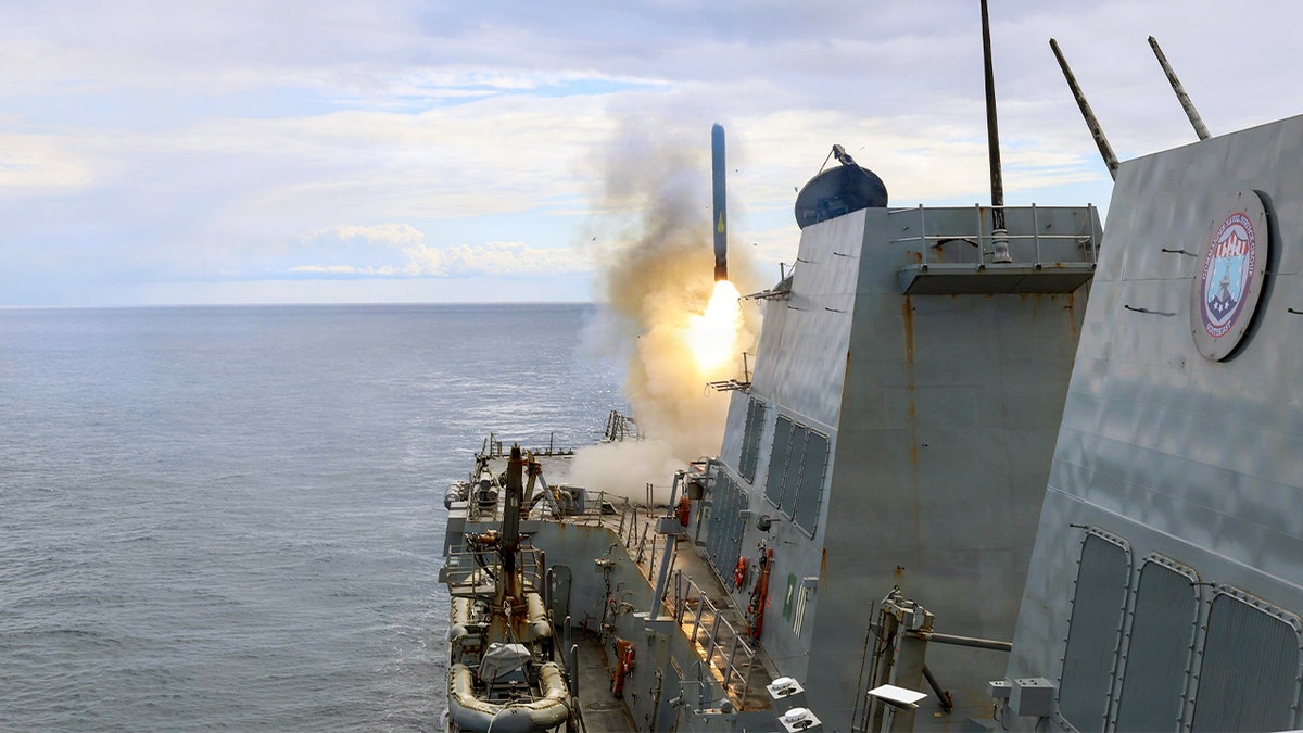 USS Thomas Hudner firing a Tomahawk missile at sea
