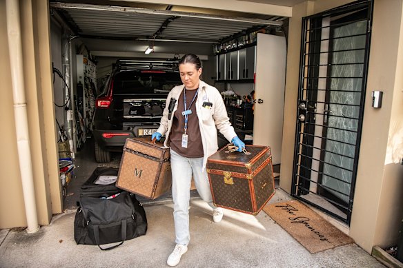Items are taken out of the Erskineville home of Annalouise Spence.