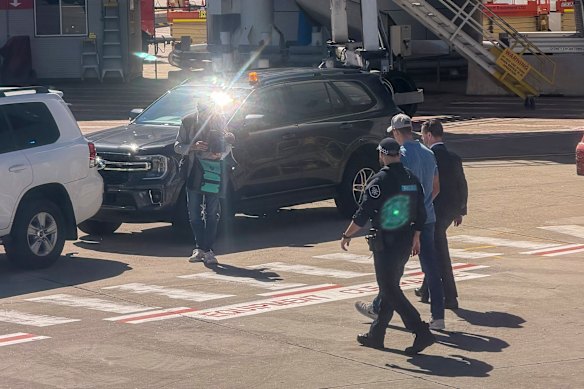 Ben Roberts-Smith is taken into custody after arriving at Sydney Airport on April 7.