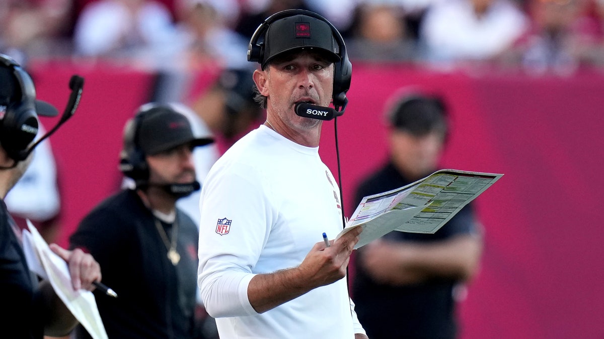 San Francisco 49ers head coach Kyle Shanahan watching from the sideline during a football game