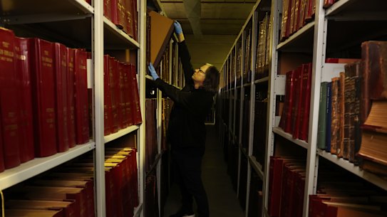 Photo special Harry Hollinsworth in the Fairfax Archives warehouse.