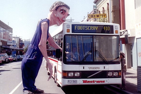Is this my bus? Dad Boom, a puppet  from Snuff Puppets, interacts with public transport in 2000.