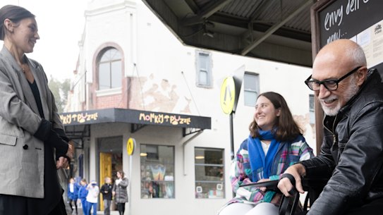 Shaun Carter with colleagues Julie Niass (left), Samantha Kirby and his dog, Robyn at a local cafe in Summer Hill, 