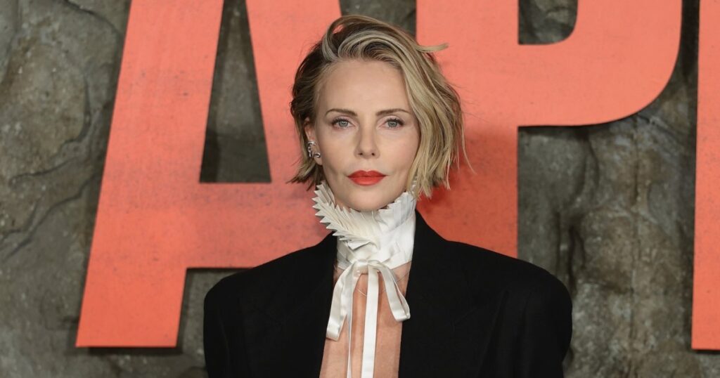 Charlize Theron Goes Topless Under Blazer and Shows Off Major Underboob at ‘Apex’ Premiere