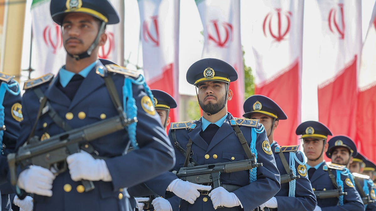 Iranian soldiers marching in a military parade in Tehran