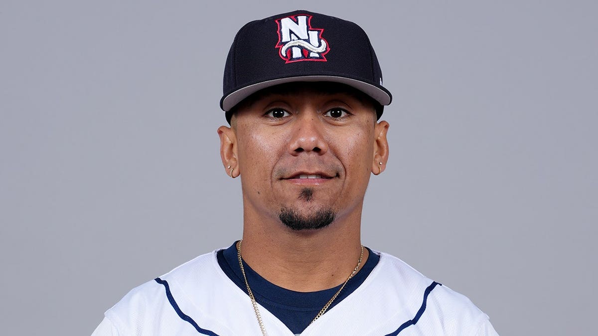 Ismael Munguia posing in New Hampshire Fisher Cats uniform at Delta Dental Stadium