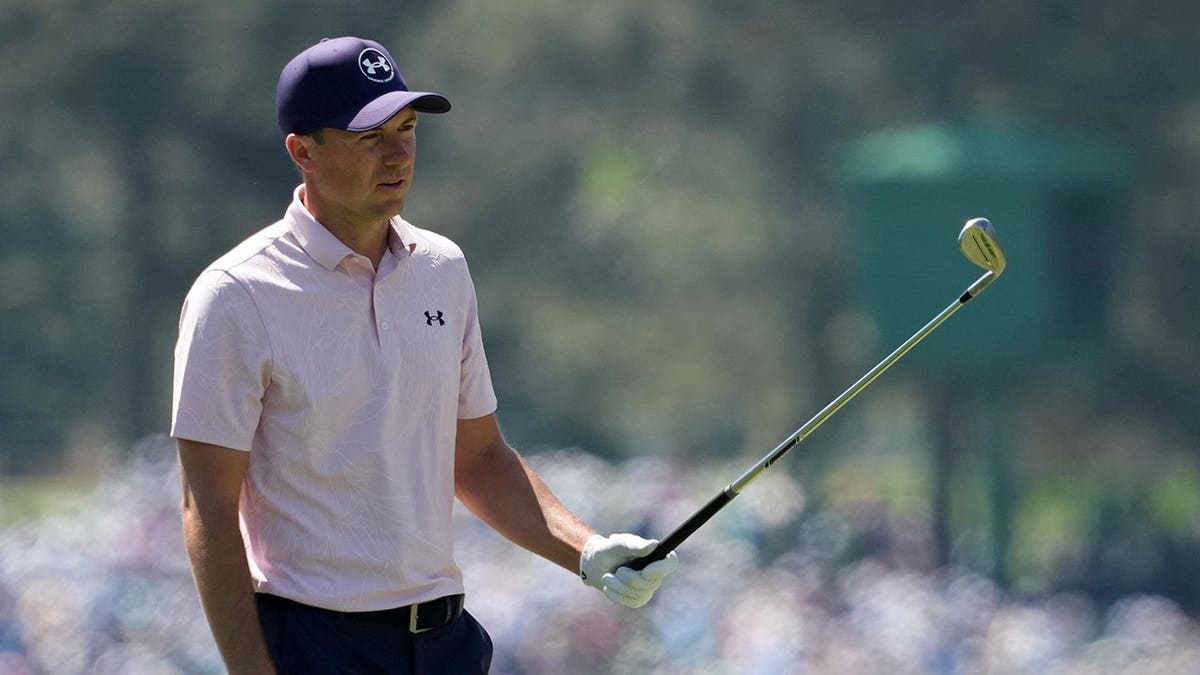 Jordan Spieth lining up a putt on the eighth green at Augusta National Golf Club